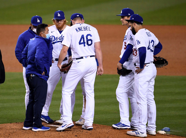 Corey Knebel, Edwin Rios, Dave Roberts, Corey Seager, Justin Turner, Dodgers trainer Yosuke "Possum" Nakajima