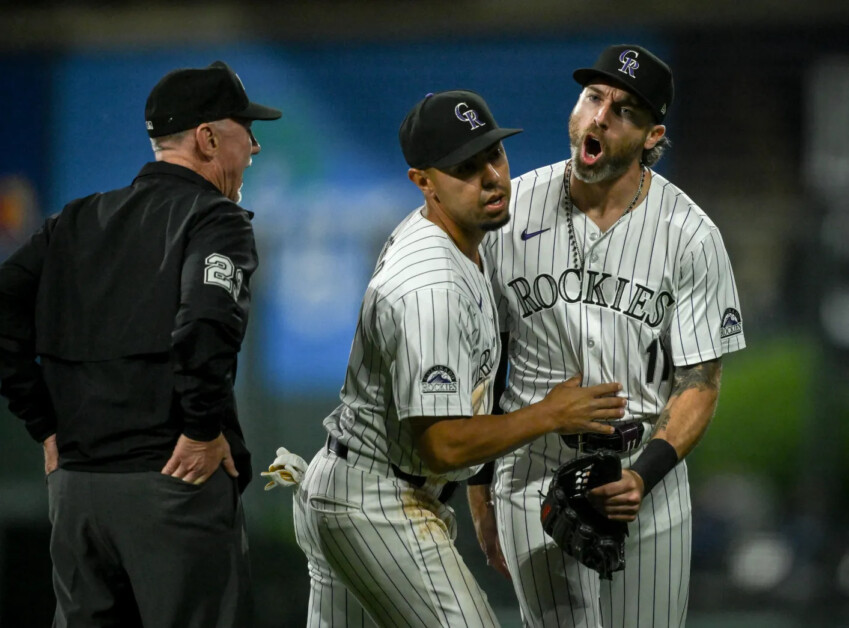 Alan Trejo, Jake Cave, umpire Lance Barksdal